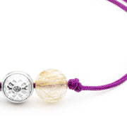 Dulgero Orb Bracelet: Handcrafted Golden Rutilated Quartz Gemstone and Silver Logo Bead