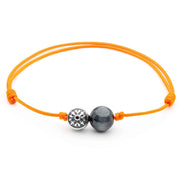 Dulgero Orb Bracelet: Handcrafted Grey Cat's Eye Gemstone and Silver Logo Bead